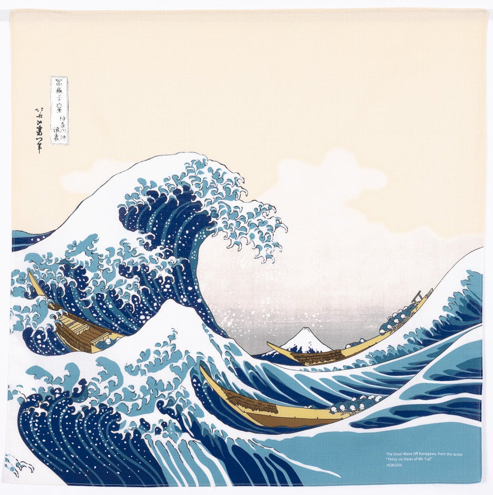 Flat lay of a square Japanese furoshiki cloth featuring Katsushika Hokusai's famous ukiyo-e artwork, The Great Wave off Kanagawa, printed on organic cotton fabric.