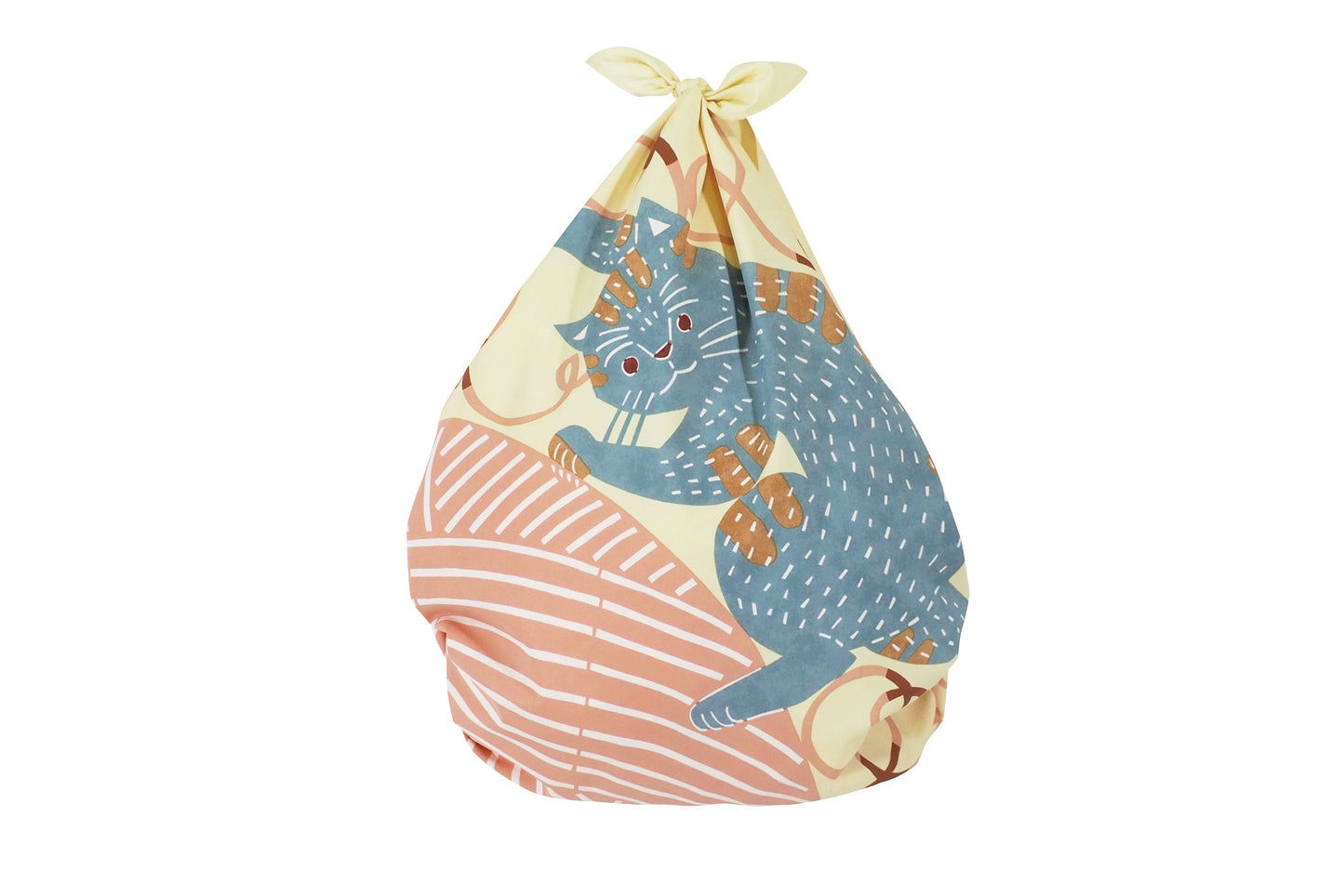 The Kata Kata cat design Furoshiki cloth shown tied at the top into a teardrop-shaped bag. The front prominently displays the playful blue striped cat clutching a large pink ball of yarn against a cream background.
