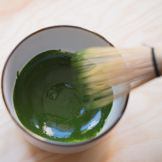 Freshly green matcha paste made with traditional Japan whisk 
